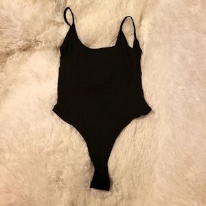 Tank top body suit, very stretchy, NWT, black size small, snaps at crotch